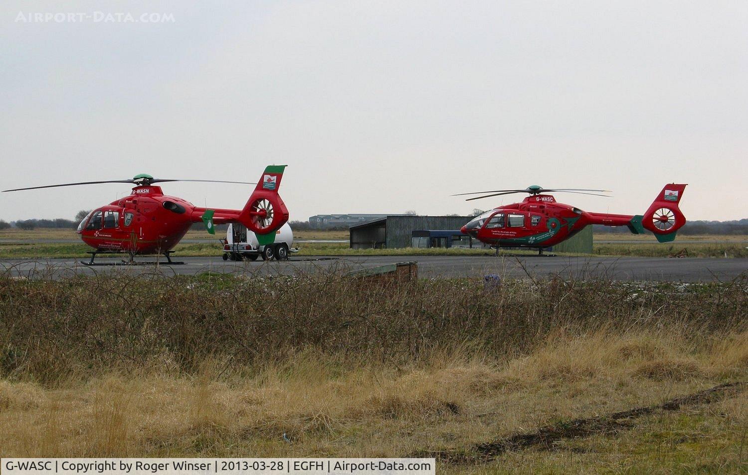 G-WASC, 2012 Eurocopter EC-135T-2+ C/N 1074, Wales Air Ambulance helicopters G-WASN (Helimed 57) and G-WASC (Helimed 59) on the apron at the South Wales Air Ambulance base at Swansea Airport.