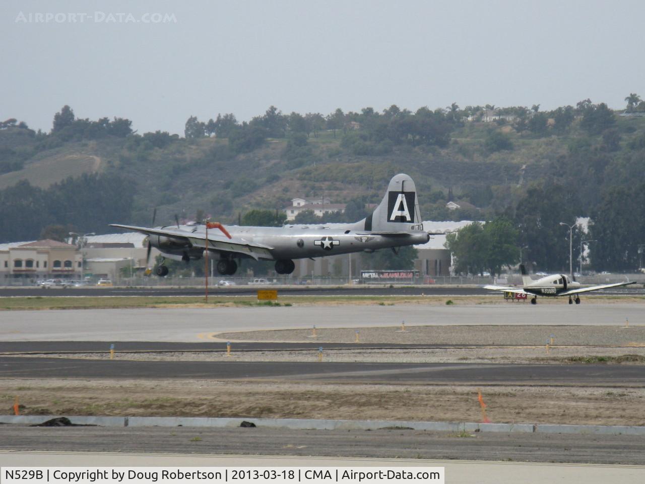 N529B, 1944 Boeing B-29A-60-BN Superfortress C/N 11547, 1944 Boeing B-29 SUPERFORTRESS 'FIFI', four Wright R3350-42 Cyclone 18 cylinder turbocharged radial engines 2,200 Hp each. Landing on CMA's displaced-threshold Rwy 26. Note adjacent windsock.