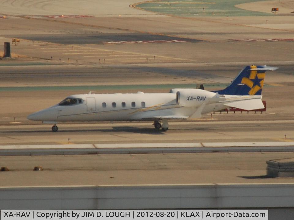 XA-RAV, 2011 Learjet 60XR C/N 60-400, SHOT @ LAX IN AUGUST 2012 LEAVING RUNWAY 25RIGHT.