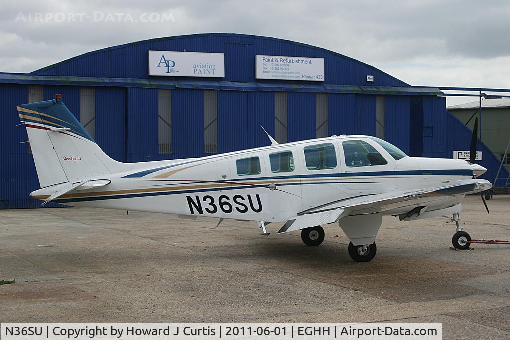 N36SU, 1996 Raytheon A36 Bonanza C/N E-3034, Outside the spray shop.