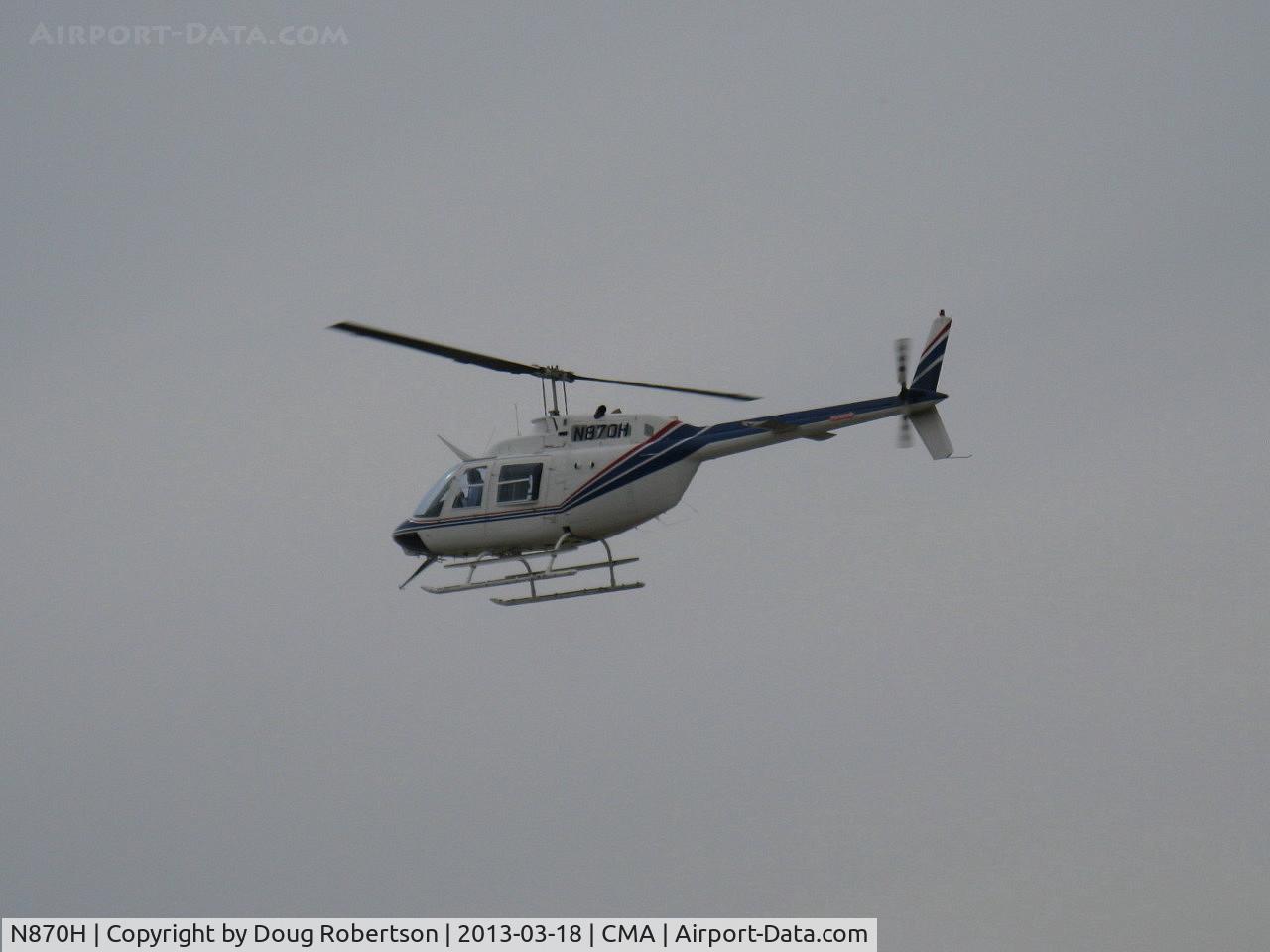 N870H, 1975 Bell 206B JetRanger II C/N 1845, 1975 Bell 206B JETRANGER II, one Allison 250-C20 Turboshaft 400 shp, orbiting the Boeing B-29 SUPERFORTRESS 'FIFI' N529B parked on the CAF ramp.