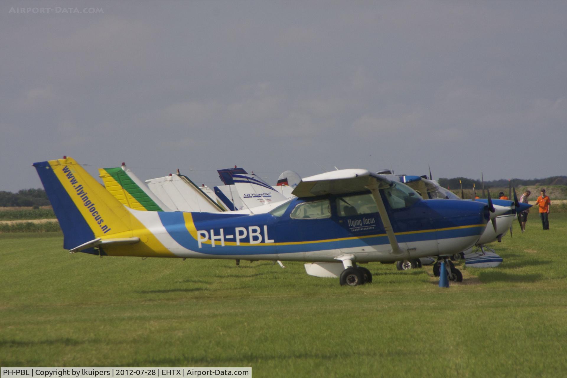 PH-PBL, 1976 Cessna 172M C/N 17267417, This Cessna is in use by Flying Focus as a photoplane. It was at the 2012 Texel Airshow