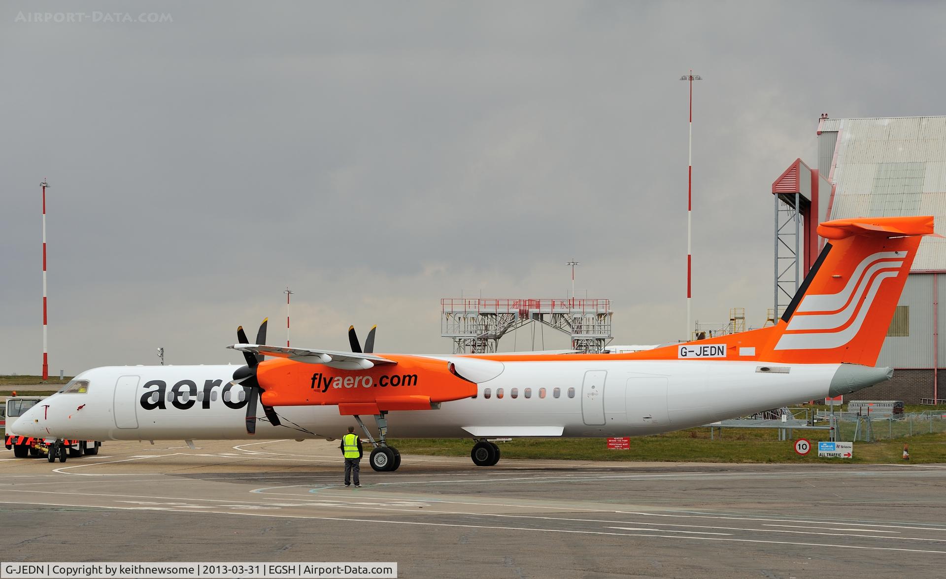 G-JEDN, 2003 De Havilland Canada DHC-8-402Q Dash 8 C/N 4078, Being towed from spray in Aero Contractors c/s.