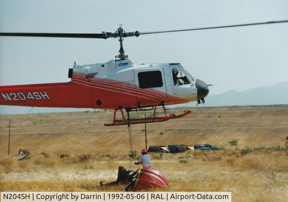 N204SH, Bell 204-B C/N 2019, Super 204 during practice Bambi Bucket loading before fire season. N204SH