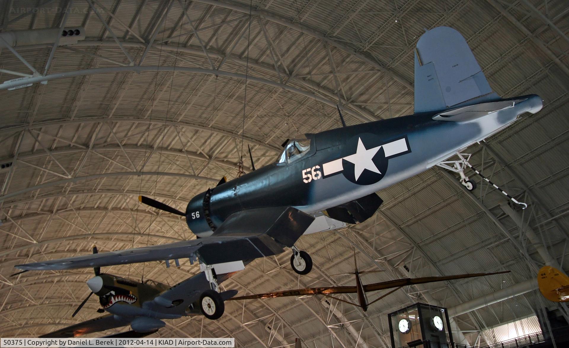 50375, Vought F4U-1D Corsair C/N 5622, A Corsair and a Curtiss P-40 appear in to be having a contest who is more aggressive.