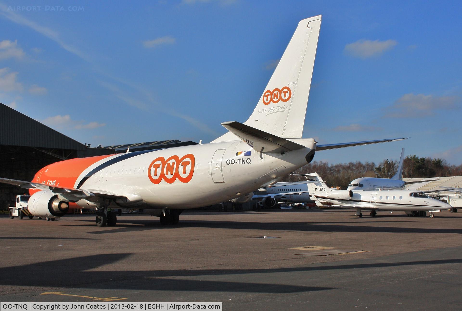 OO-TNQ, 1998 Boeing 737-4M0 C/N 29205, Exiting service bay at European Aviation past crew ferry Learjet M-TNTJ
