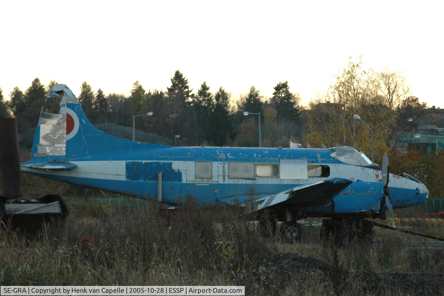SE-GRA, 1953 De Havilland DH-104 Dove 6 C/N 04437, Still in the livery of its previous owner, Fjällräven, this Dove is standing on the exercise area of the fire brigade of Norrköping Kungsängen airport, in deteriorating condition.