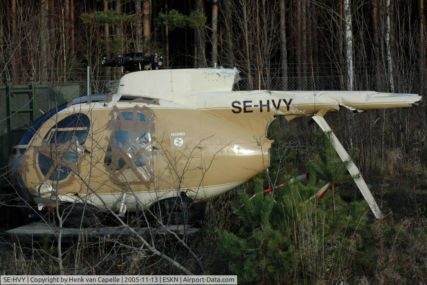 SE-HVY, 1977 Hughes 369D C/N 970188D, Hughes 369D wreckage stored at Nyköping Skavsta airport, Sweden.  On October 4, 2005, it was substantially damaged when it collided with terrain after takeoff from Hangelosa, Sweden. The pilot received minor injuries. Compressor failure.