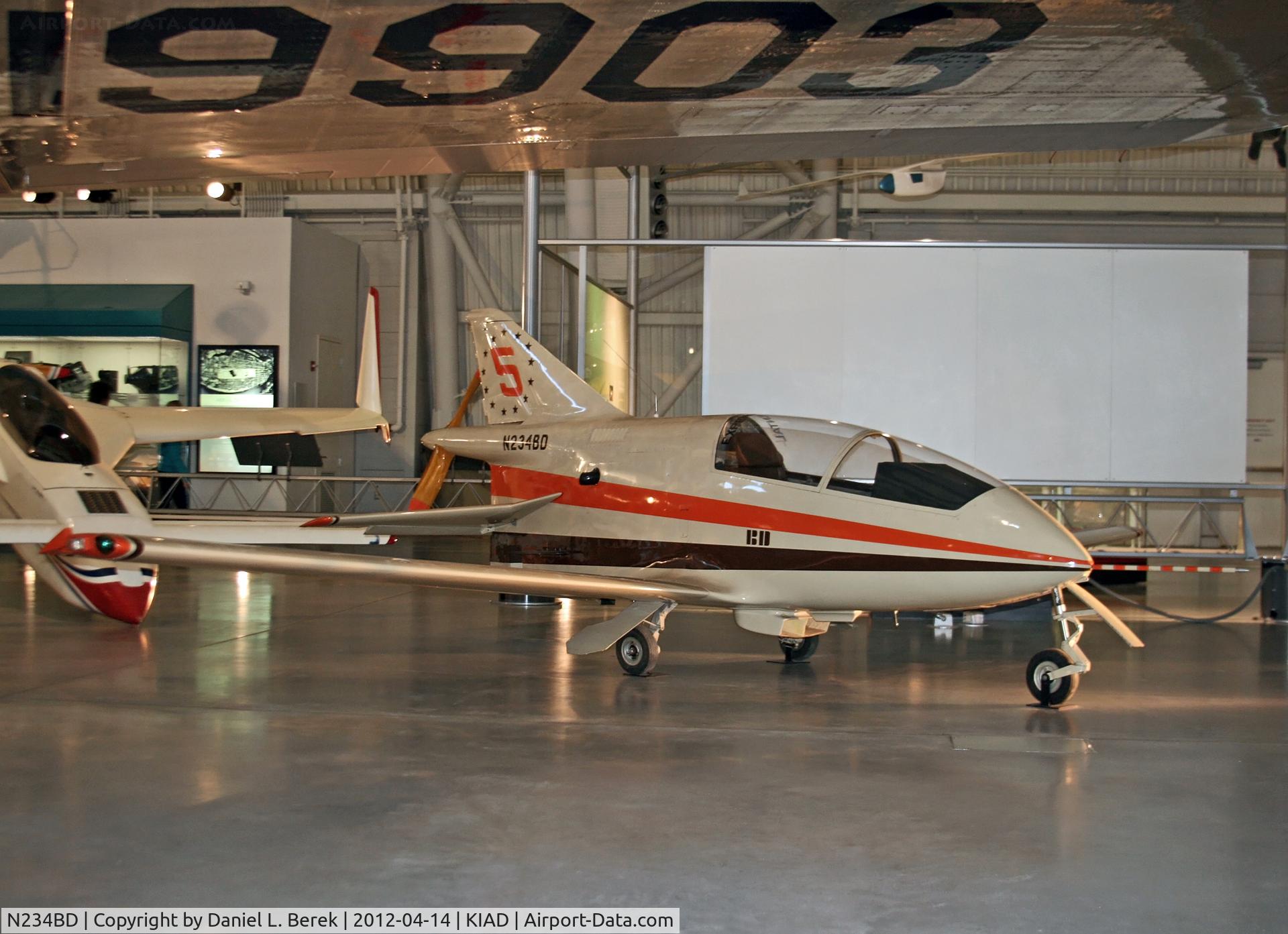 N234BD, Bede BD-5B C/N 2731001, The massive wing of the Boeing Stratoliner frames this diminutive homebuilt.