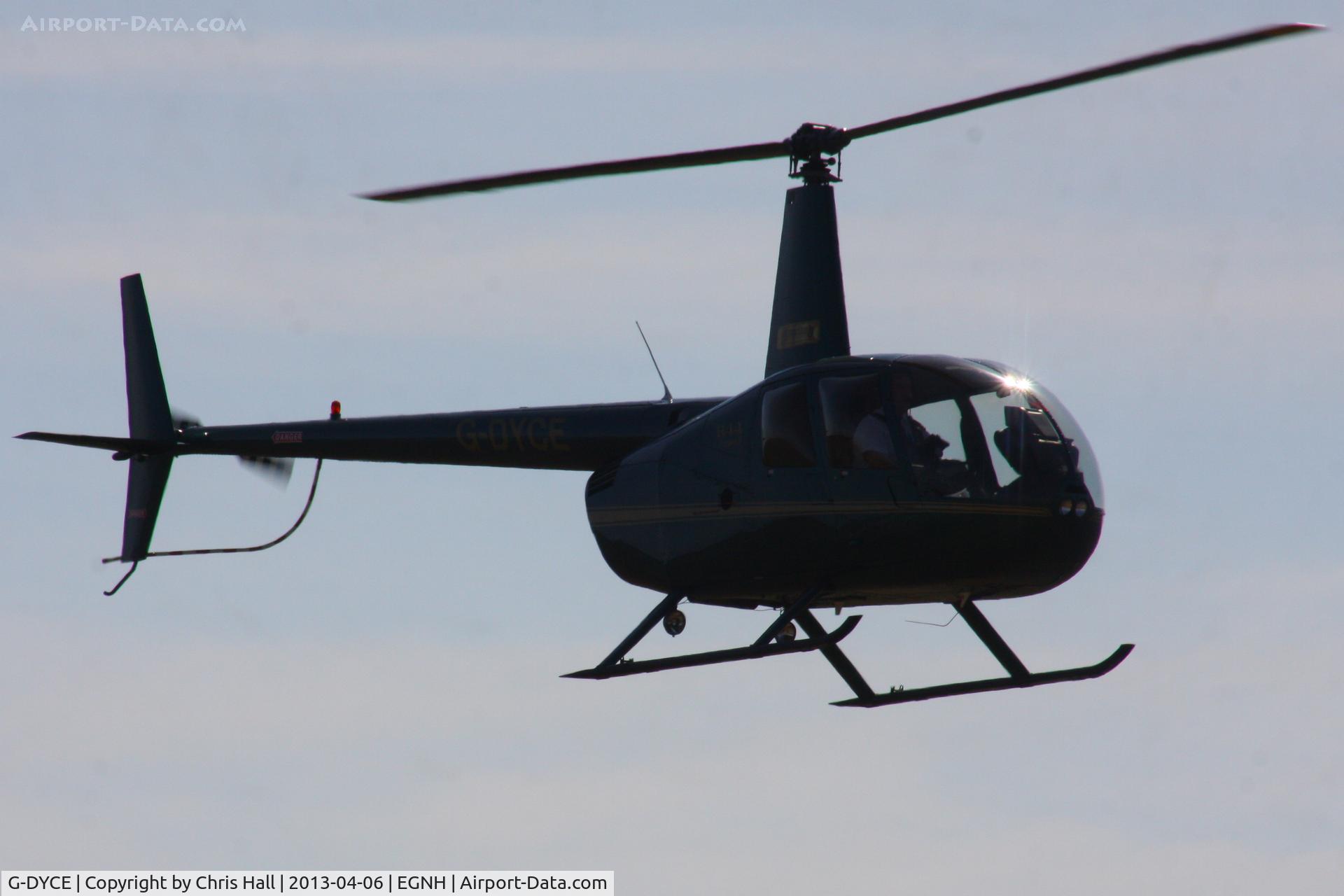 G-DYCE, 2003 Robinson R44 Raven II C/N 10148, oming out of the sun