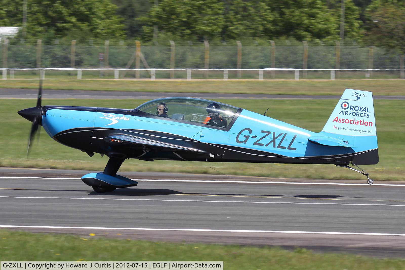 G-ZXLL, 2011 Extra EA-300L C/N 1319, At the Farnborough Air Show.