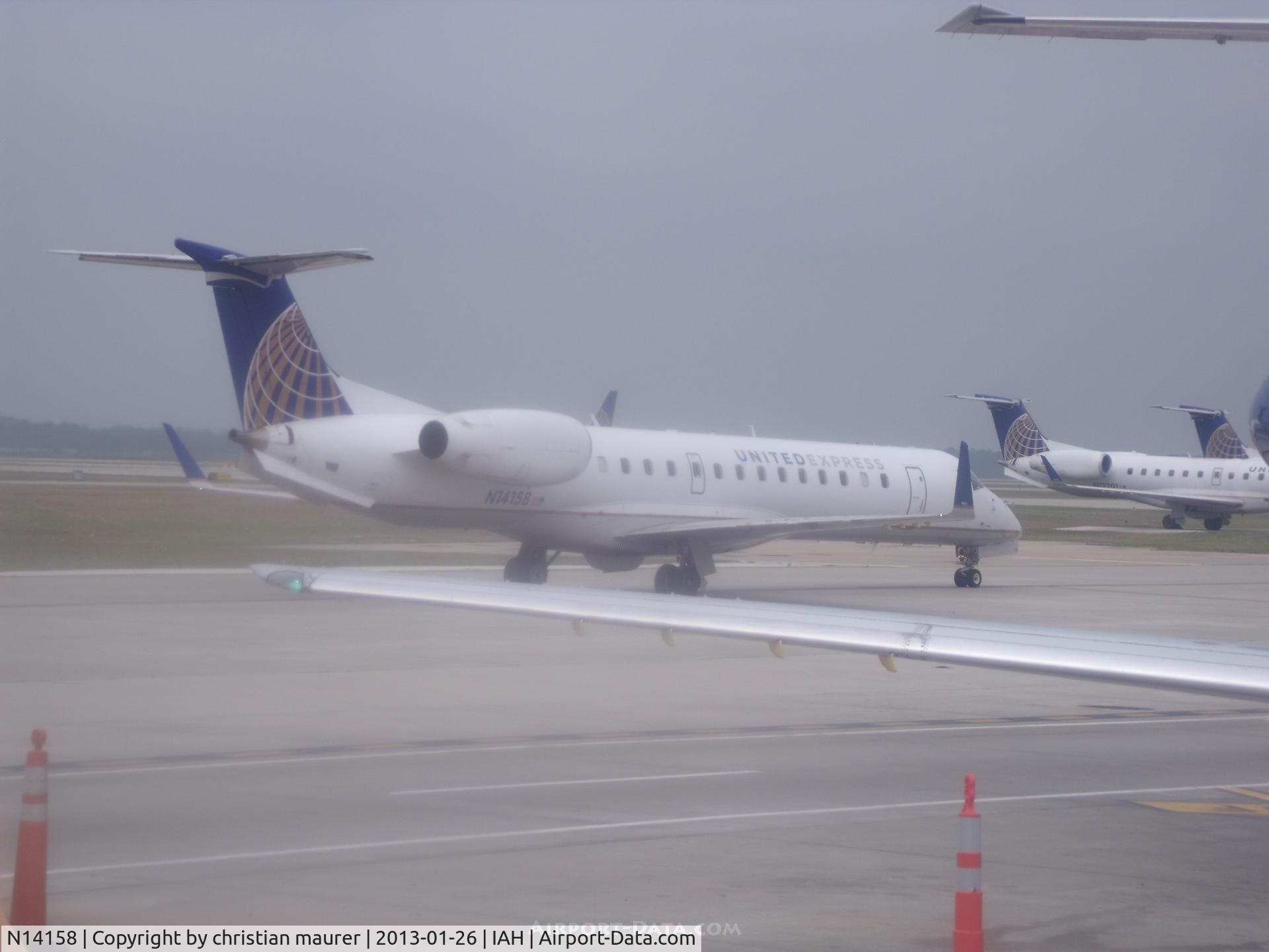 N14158, 2004 Embraer ERJ-145XR (EMB-145XR) C/N 145791, erj-145xr taxing to runway 15L