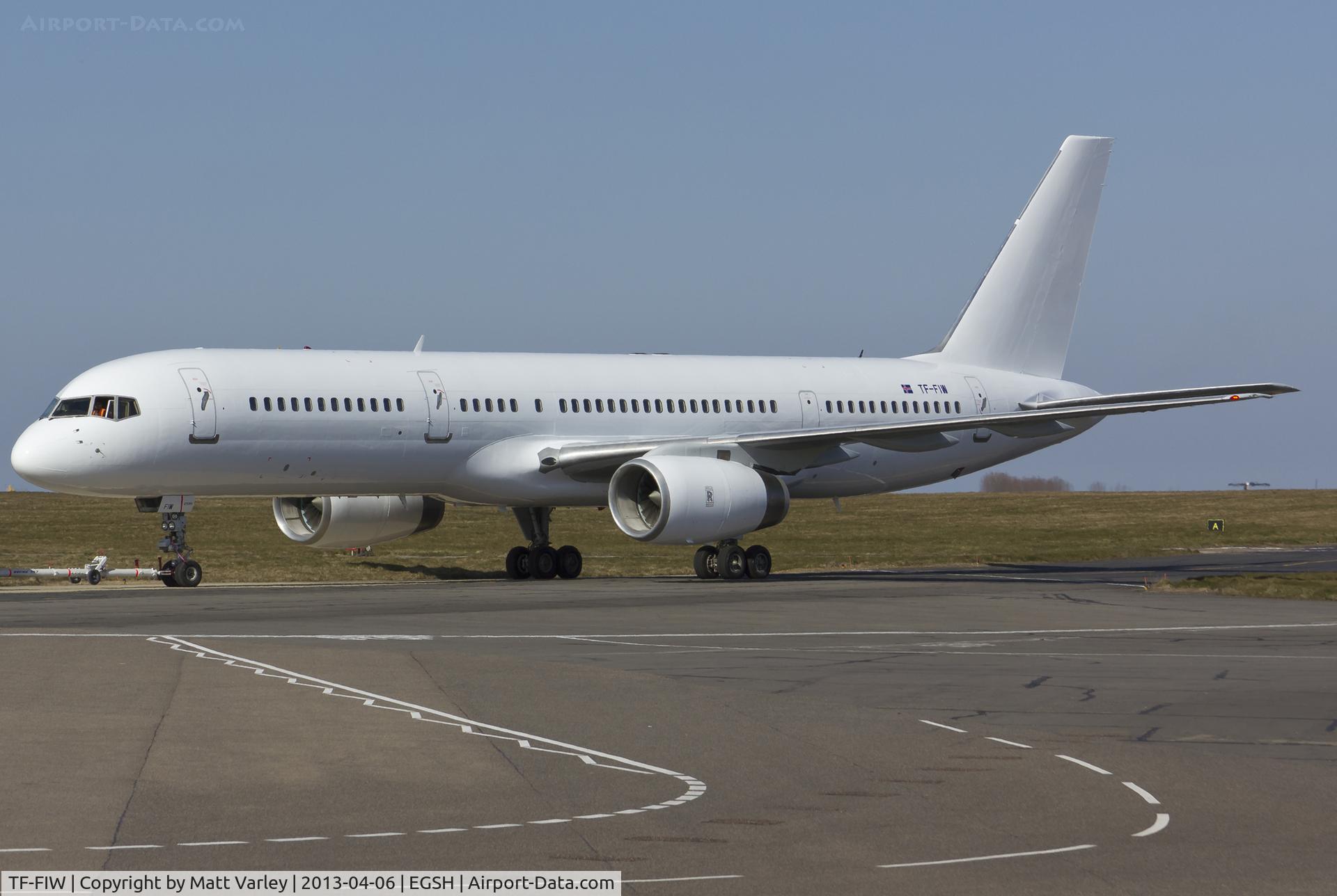 TF-FIW, 1990 Boeing 757-27B/ER C/N 24838, Being towed to stand 5 after spray by Air Livery.