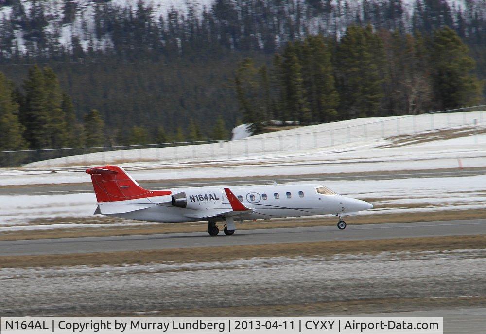 N164AL, 1997 Learjet Inc 31A C/N 31-134, Taking off at Whitehorse, Yukon (CYXY), bound for Anchorage, Alaska (ANC).