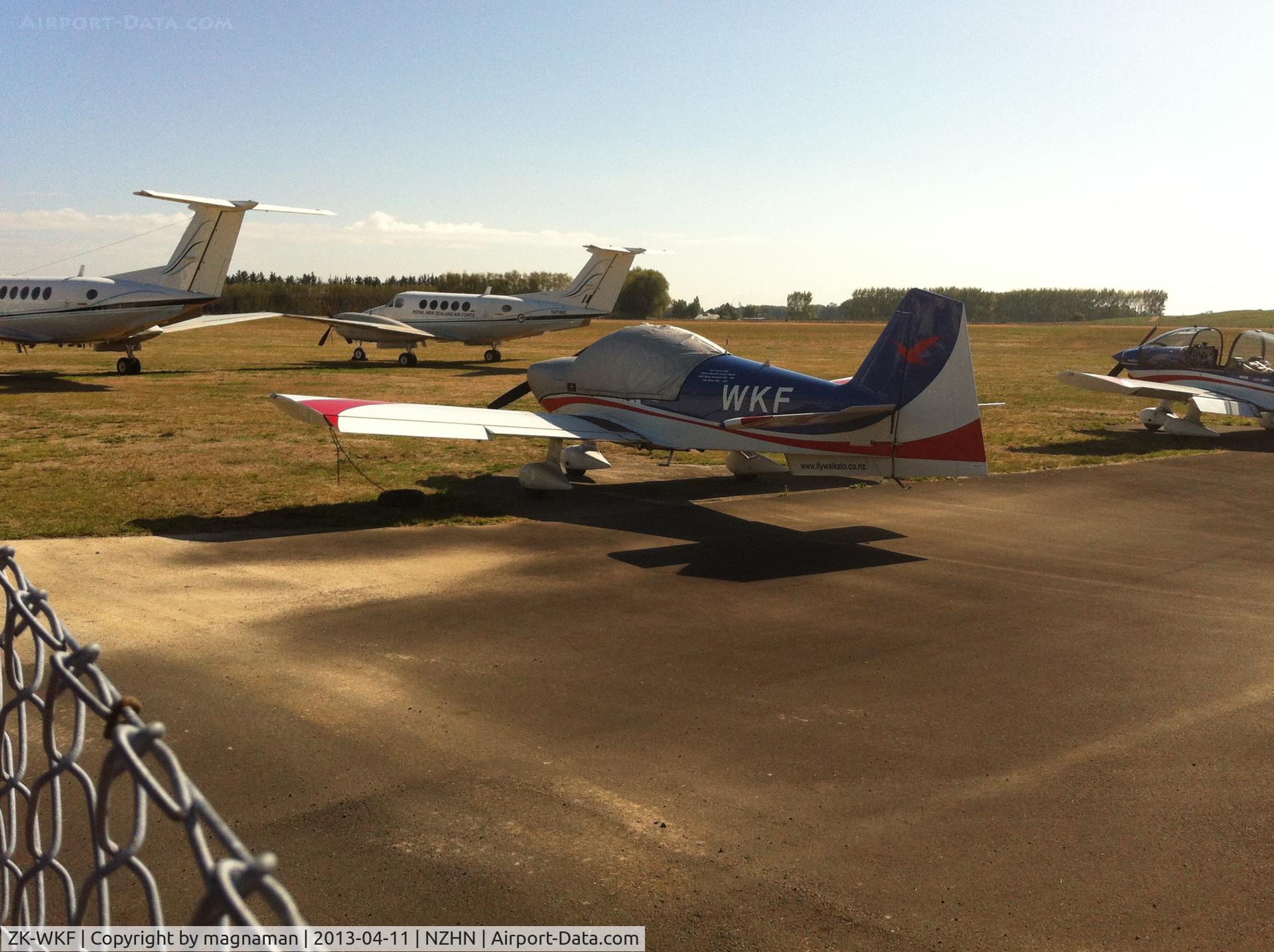 ZK-WKF, 2006 Alpha R2160 C/N 160A-06002, With NZ1885 RNZAF B200 in background and another with no markings at all.