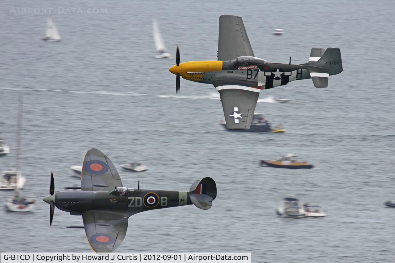 G-BTCD, 1944 North American P-51D Mustang C/N 122-39608, In close formation with Spitfire MH434 at the Bournemouth Air Festival.