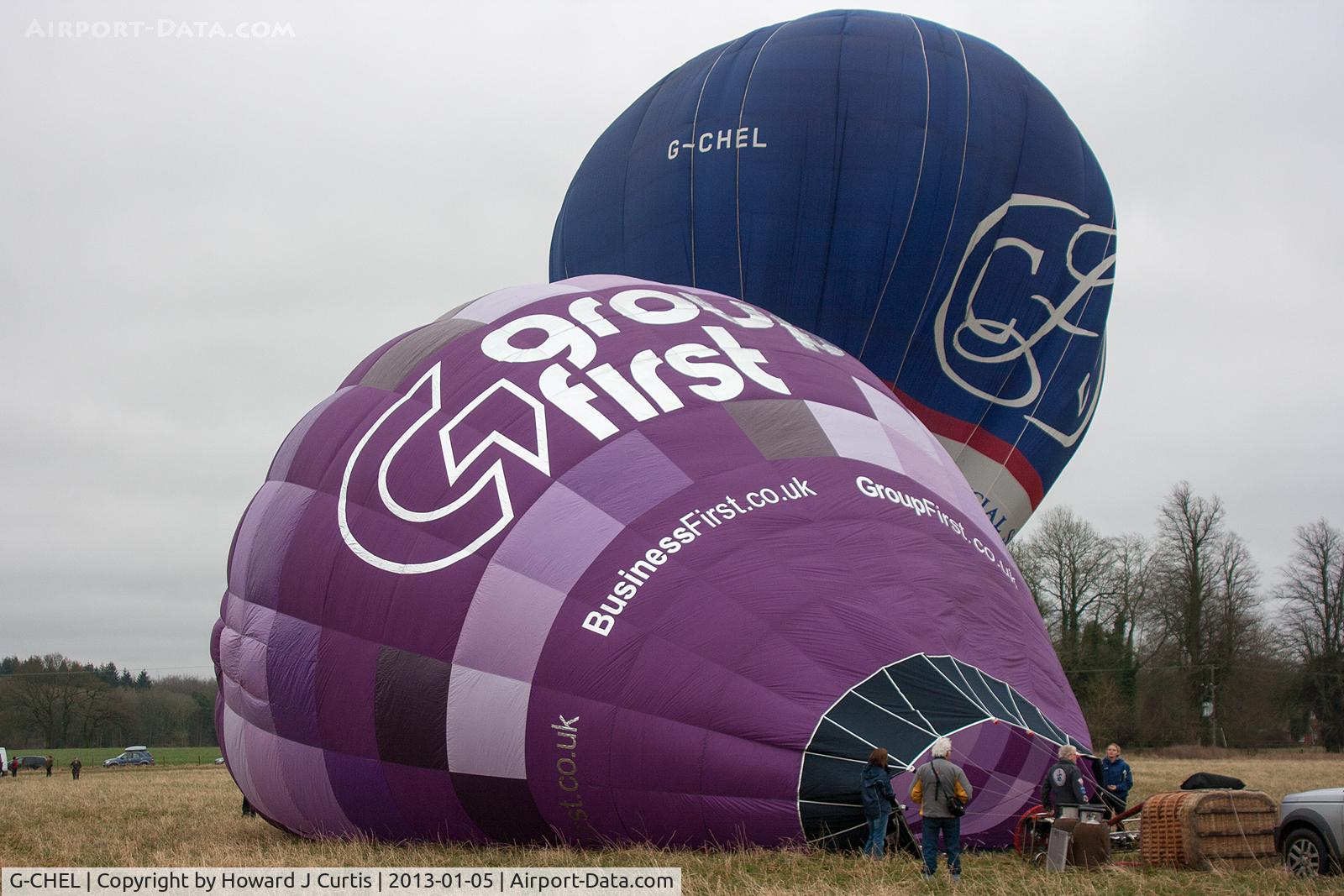 G-CHEL, 2000 Cameron Balloons Colt 77B C/N 4823, At the 2013 Icicle Balloon Meet, Savernake Forest, Wilts. With G-TWSZ being inflated in front.
