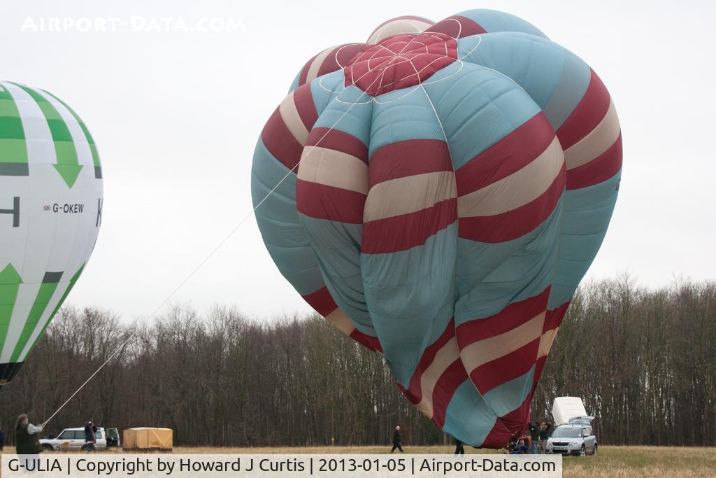 G-ULIA, 1992 Cameron Balloons V-77 C/N 2860, At the 2013 Icicle Balloon Meet, Savernake Forest, Wilts. Being inflated.