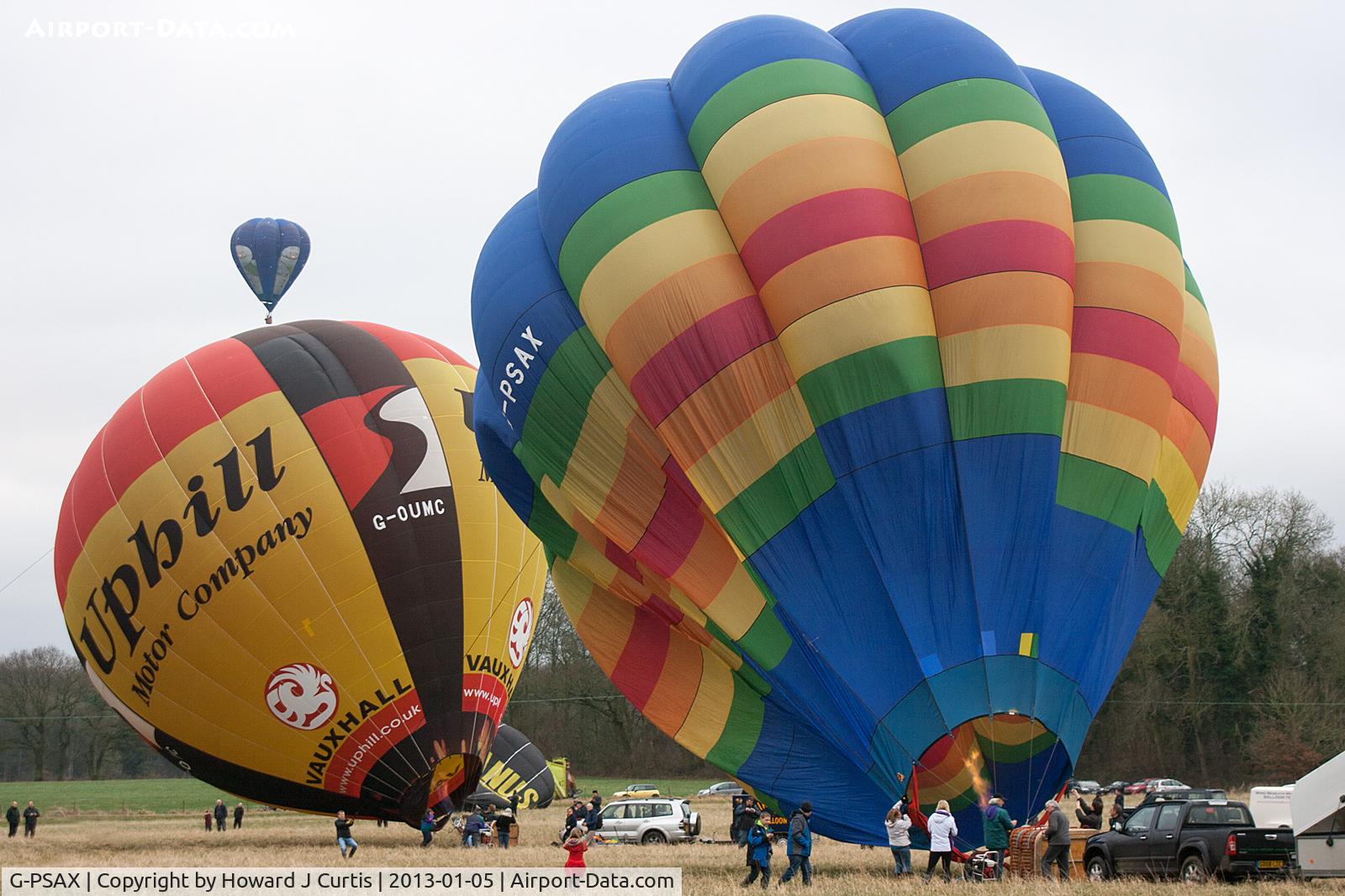 G-PSAX, 2003 Lindstrand Balloons Ltd LBL 77B C/N 960, At the 2013 Icicle Balloon Meet, Savernake Forest, Wilts. G-OUMC almost inflated behind and G-SNOW already airborne.