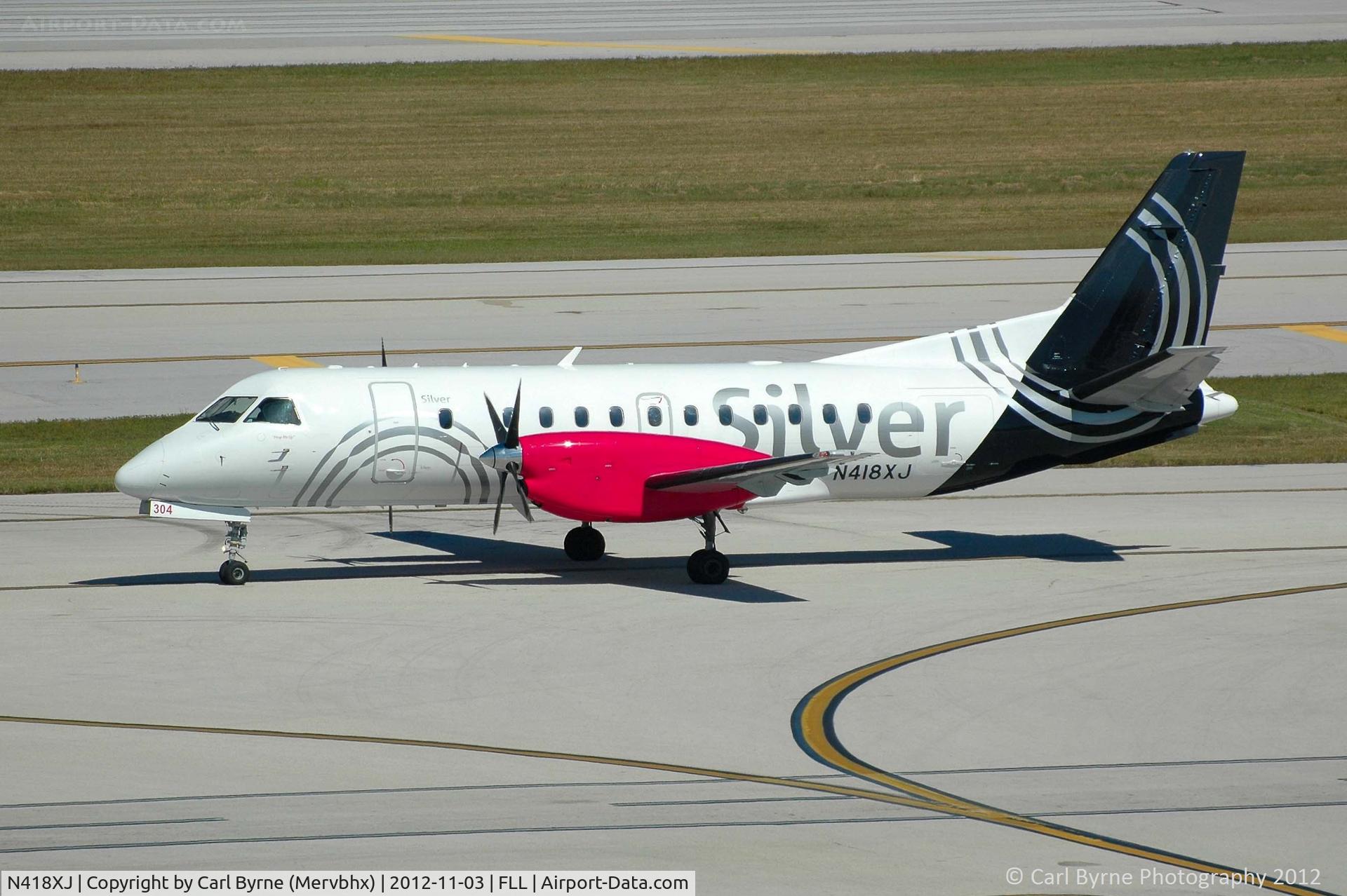 N418XJ, 1997 Saab 340B C/N 340B-418, Taken from the Hibiscus car park viewing area.