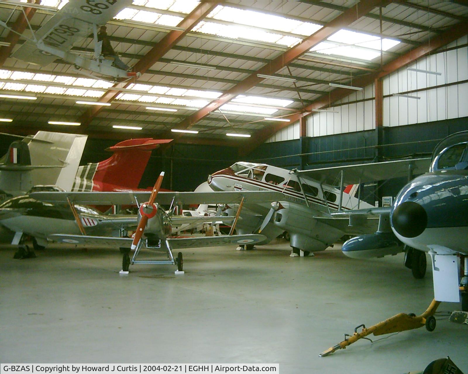 G-BZAS, 2000 Isaacs Fury II C/N PFA 011-10837, General view of the Bournemouth Aviation Museum. [L-R]: Meteor G-LOSM, Buccaneer XX897, Vampire G-HELV, Leopard G-BRNM, Gnat XR537, Dragon Rapide G-AGSH, Hunter G-HVIP and Grasshopper WZ798 hanging above.