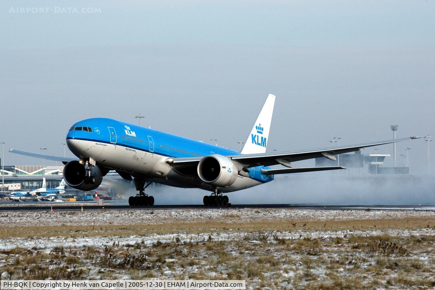 PH-BQK, 2005 Boeing 777-206/ER C/N 29399, KLM Boeing 777-200 kicking up snow while rotating for take off from Amsterdam Schiphol airport.