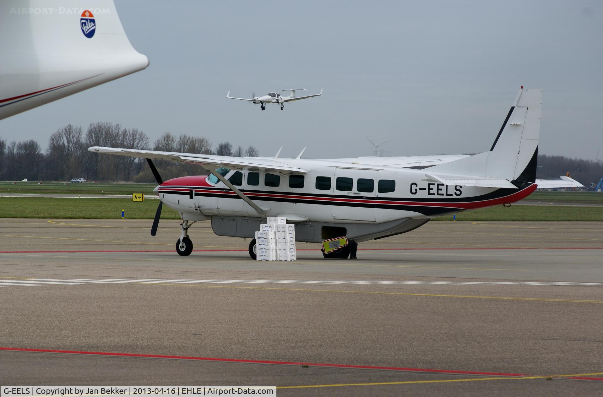 G-EELS, 1997 Cessna 208B Grand Caravan C/N 208B0619, Platform Lelystad.Delivering some packages with glass eels. Jonge paling uit Engeland wordt aangevoerd via Lelystad om te worden uitgezet in de randmeren van het IJsselmeer.
