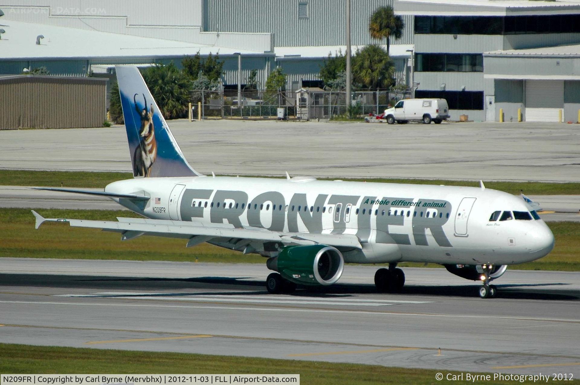 N209FR, Airbus A320-214 C/N 4641, Taken from the Hibiscus car park viewing area.