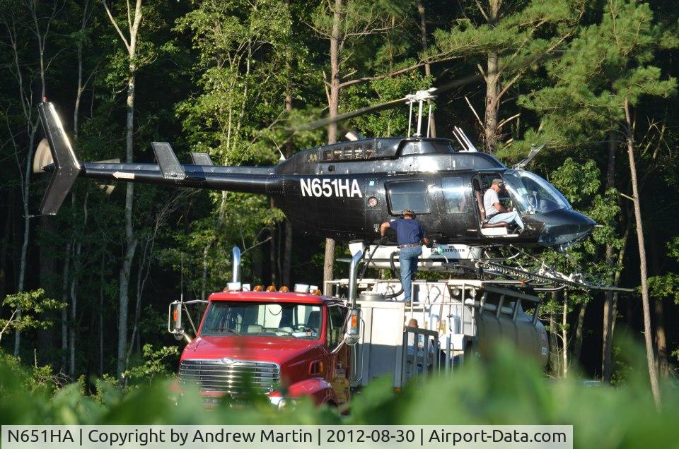 N651HA, 1986 Bell 206L-3 LongRanger III C/N 51185, Loading herbicide Delaware Wild Land's Great Cypress Swamp.