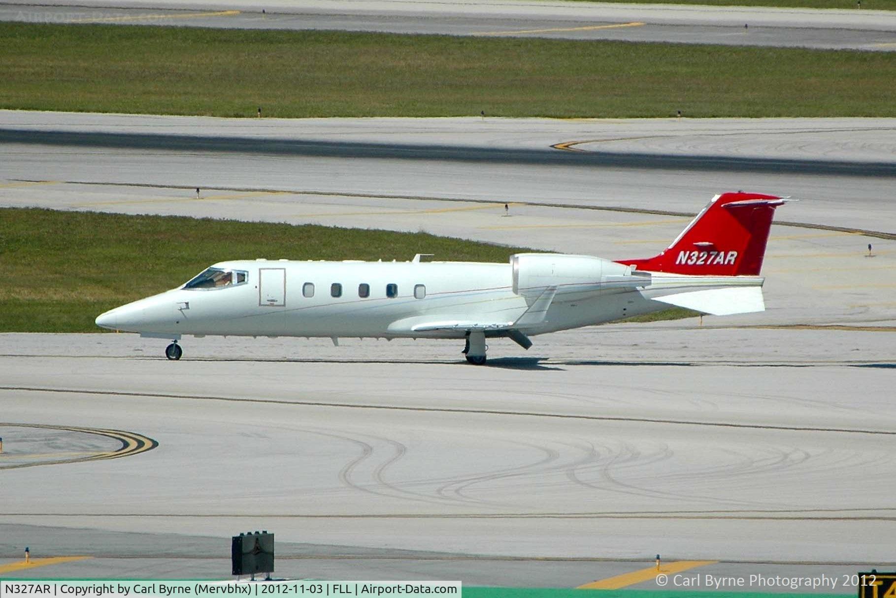 N327AR, 2006 Learjet 60 C/N 60-311, Taken from the Hibiscus car park viewing area.