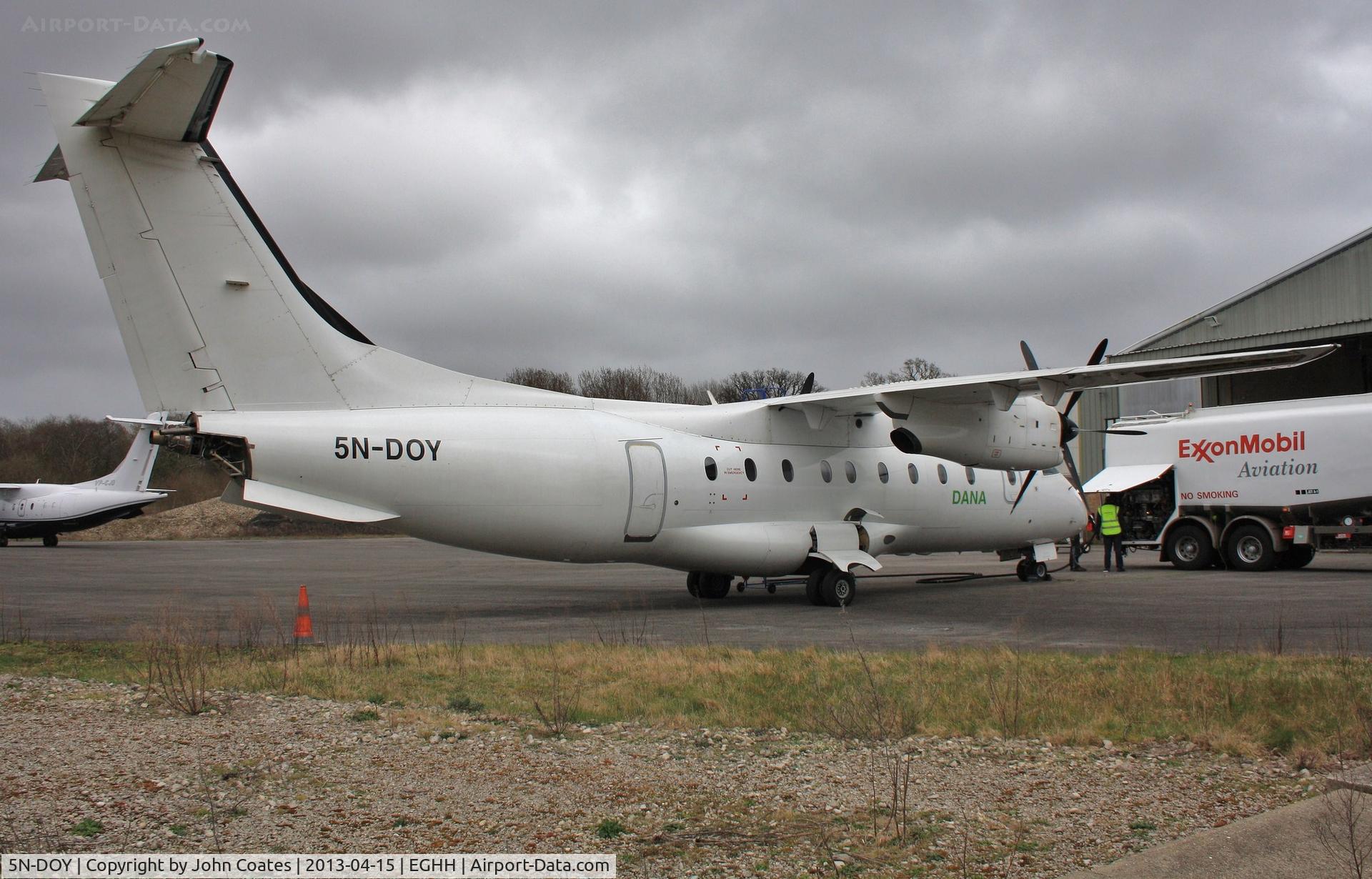5N-DOY, 1998 Dornier 328-100 C/N 3089, Being fuelled with parts still to be refitted