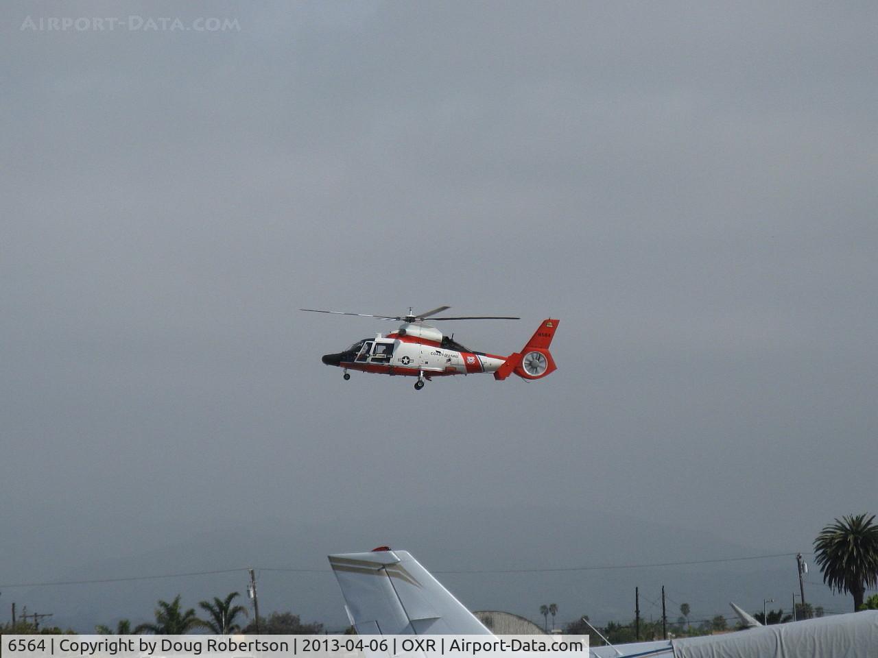 6564, 1987 Aerospatiale HH-65C Dolphin C/N 6250, Aerospatiale MH-65C DOLPHIN of USCG, two Turbomeca Arriel 2C-CG Turboshaft engines 934 shp each, 6564 of USCG Los Angeles repainted? approaching OXR for landing.