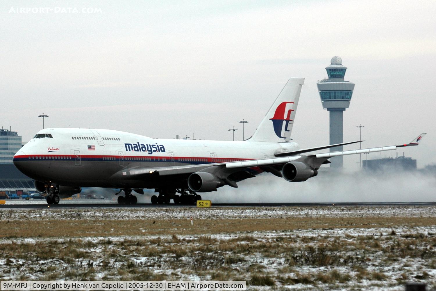 9M-MPJ, 1997 Boeing 747-4H6 C/N 28426, Malaysia Airlines Boeing 747-400 kicking up snow while taking off from Amsterdam Schiphol airport, the Metherlands.