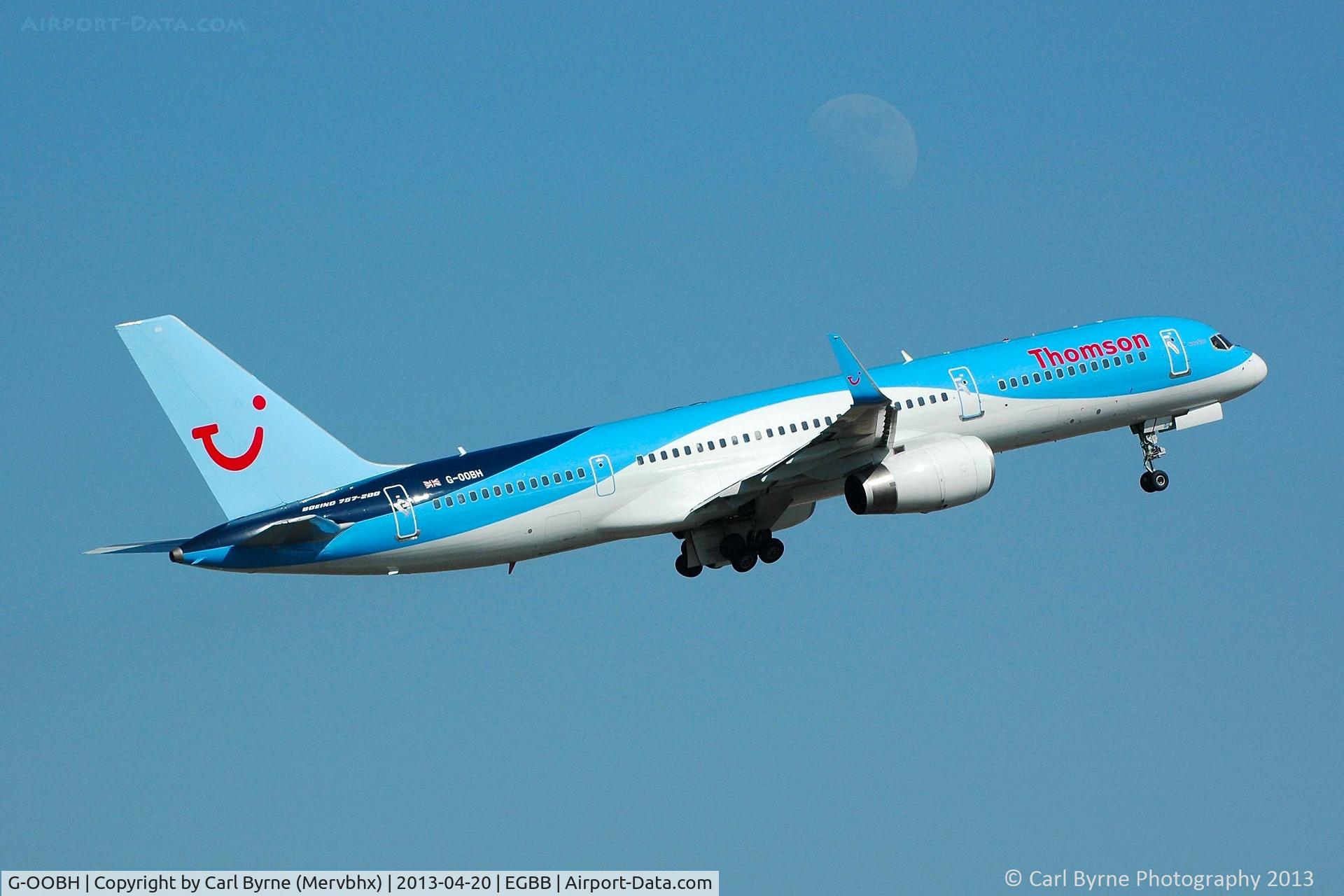 G-OOBH, 1999 Boeing 757-236 C/N 29944, Climbing out past the moon. Taken from the Elmdon Multi-Storey car park.