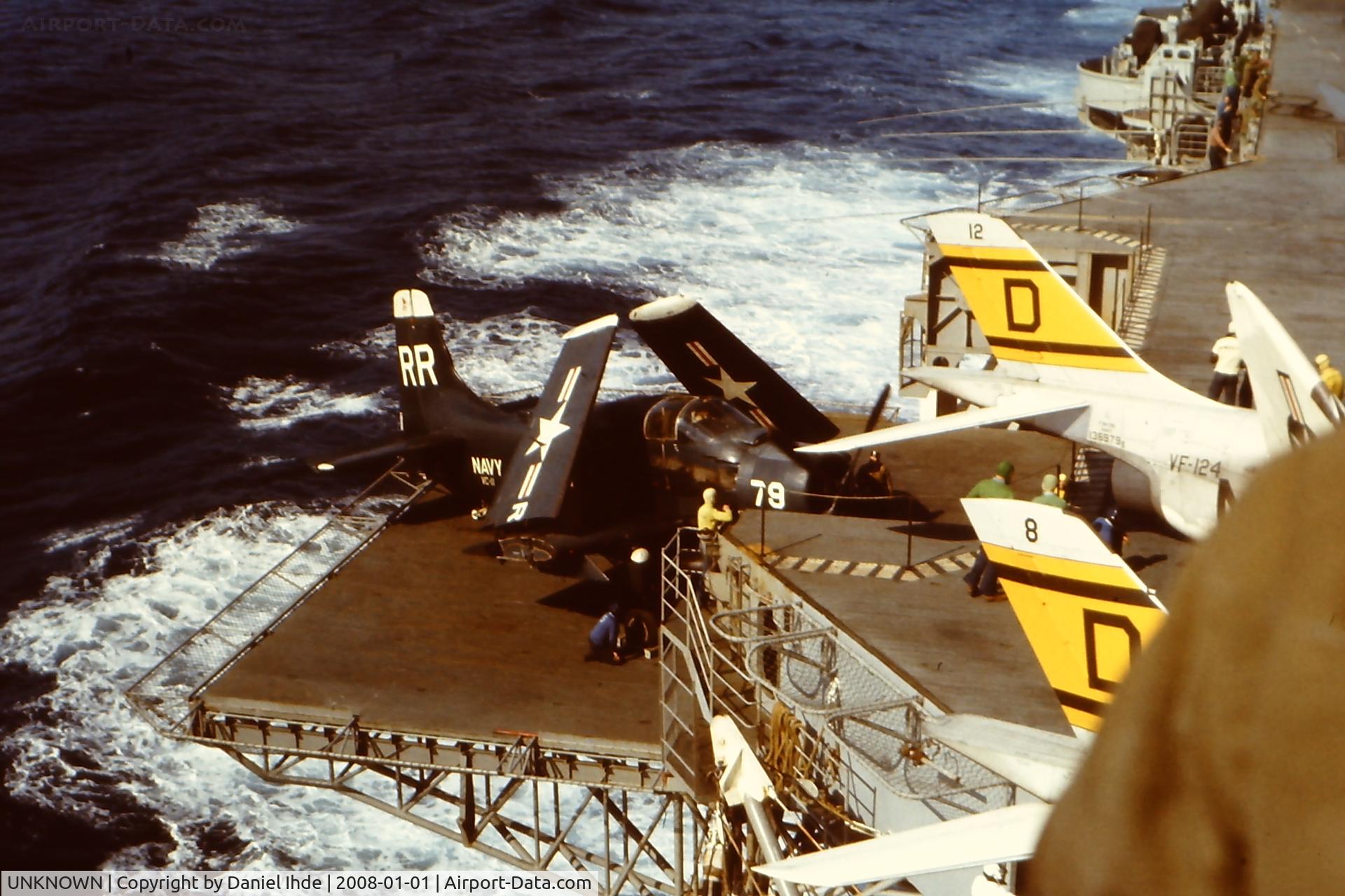 UNKNOWN, Miscellaneous Various C/N unknown, A-5 (or is it an A-6) being lifted to the flight deck for take off.
