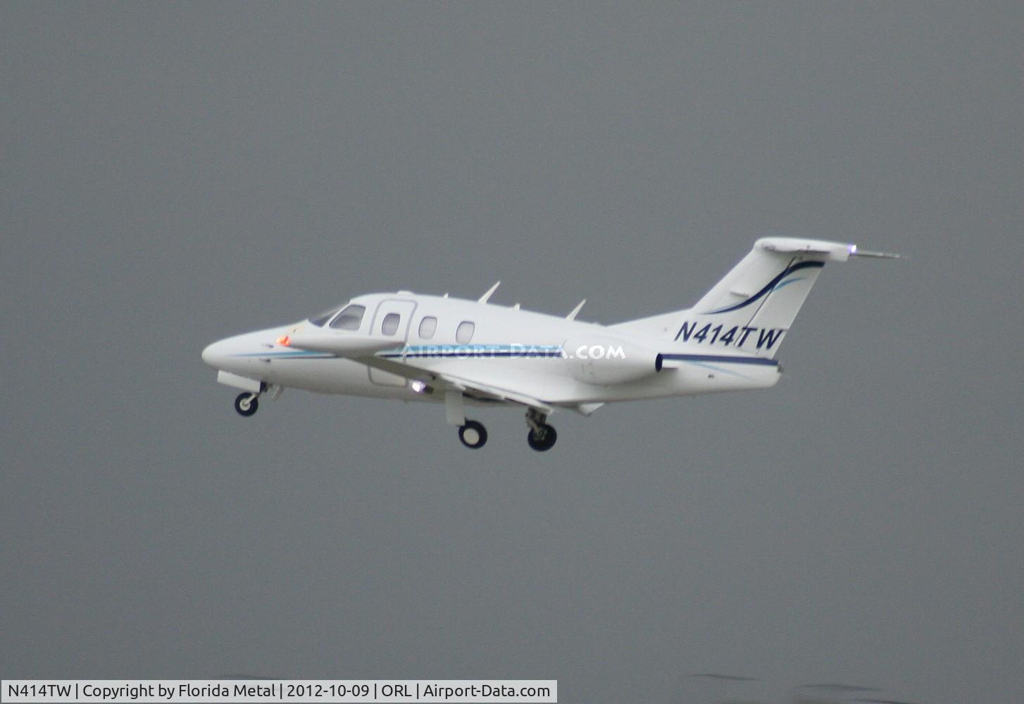N414TW, 2008 Eclipse Aviation Corp EA500 C/N 000147, Eclipse 500 taking off into thunderstorm