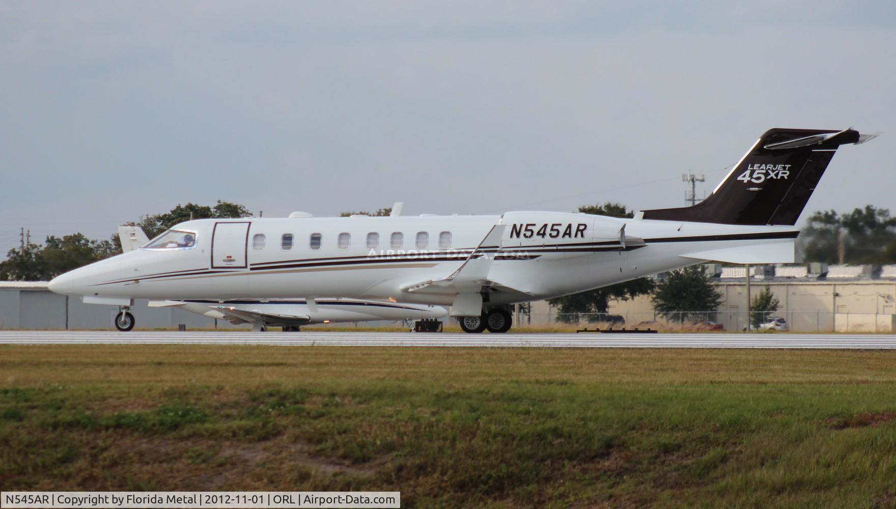 N545AR, 2011 Learjet Inc 45XR C/N 45-423, Lear 45XR leaving NBAA