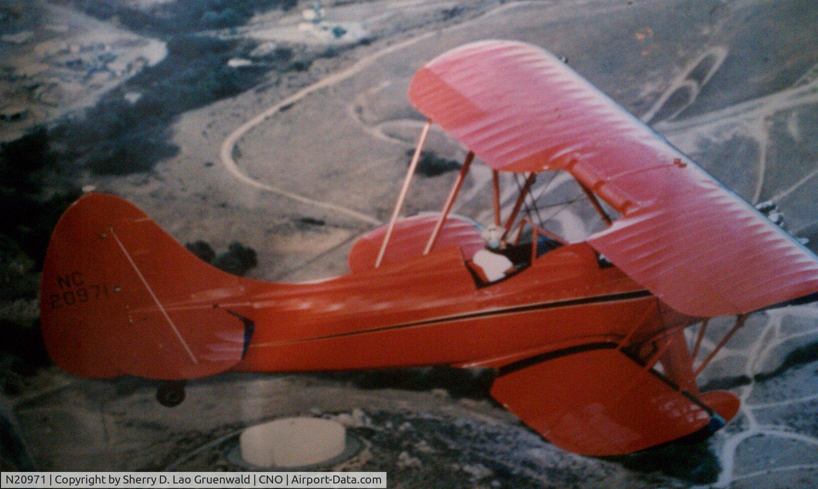 N20971, 1940 Waco UPF-7 C/N 5317, I owned this plan for many years on Chino airport.....Big Red.  Sherry Gruenwald Lao