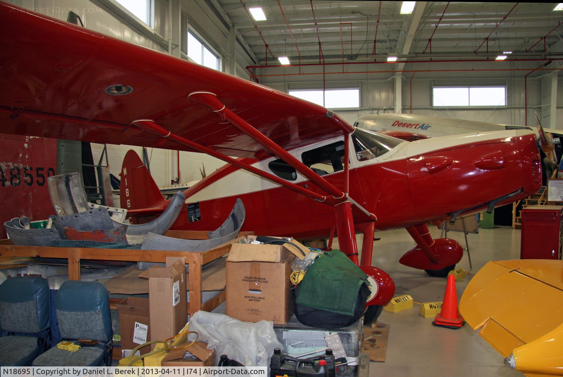N18695, 1939 Fairchild 24W-9 C/N W9-213, This Golden Age beauty gets attention at the hangar of the Champaign Air Museum.