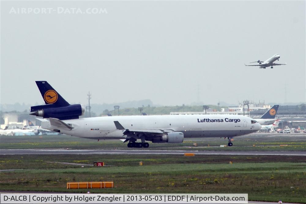 D-ALCB, 1998 McDonnell Douglas MD-11F C/N 48782, Arriving giant on rwy 07R is waiting for outbounding gnom on rwy 07C...