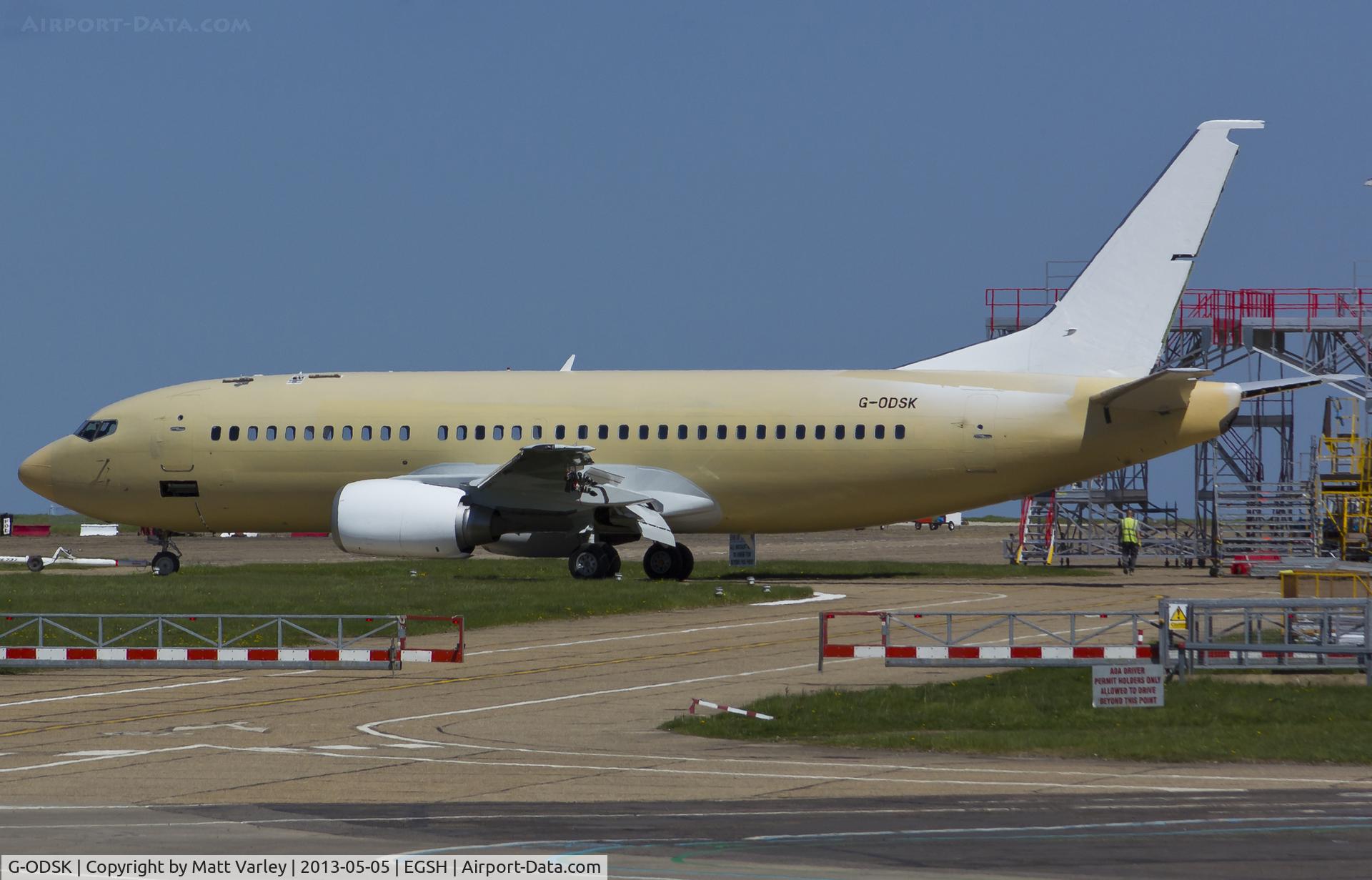 G-ODSK, 1997 Boeing 737-37Q C/N 28537, Being towed to stand after spray.