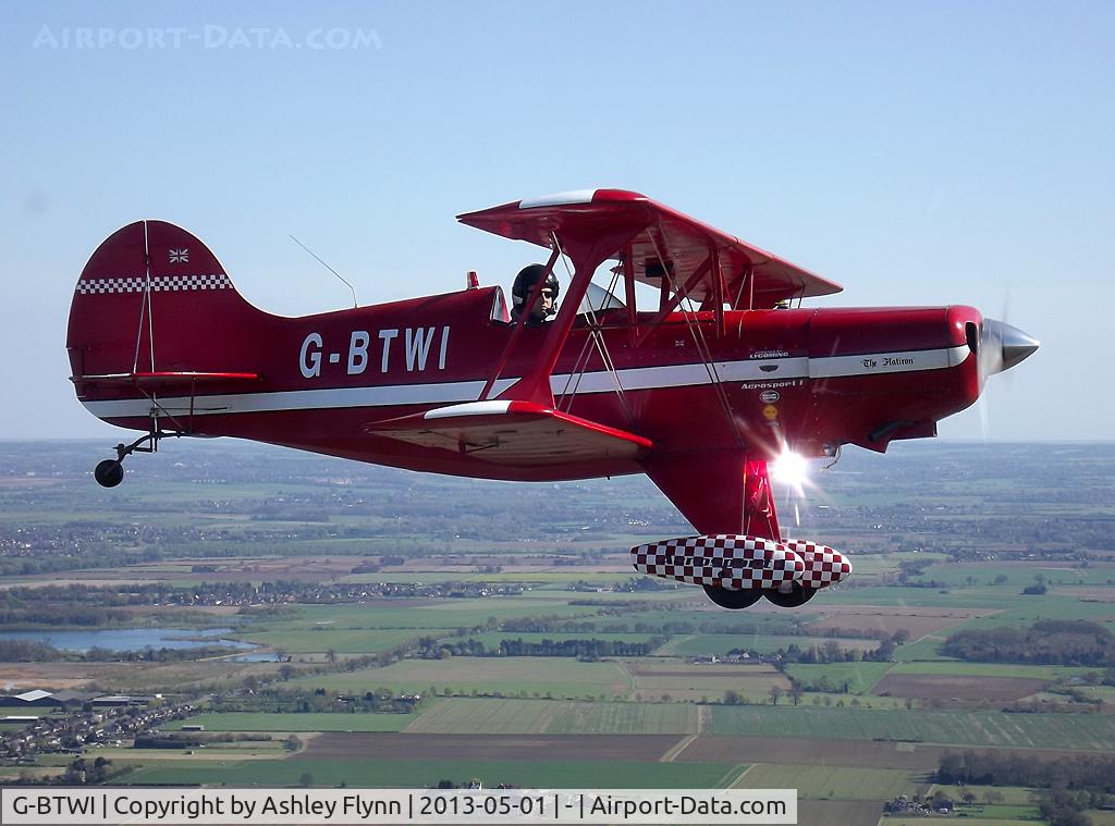 G-BTWI, 1976 EAA Acro Sport I C/N 230, In formation. Caught the strobe light nicely.