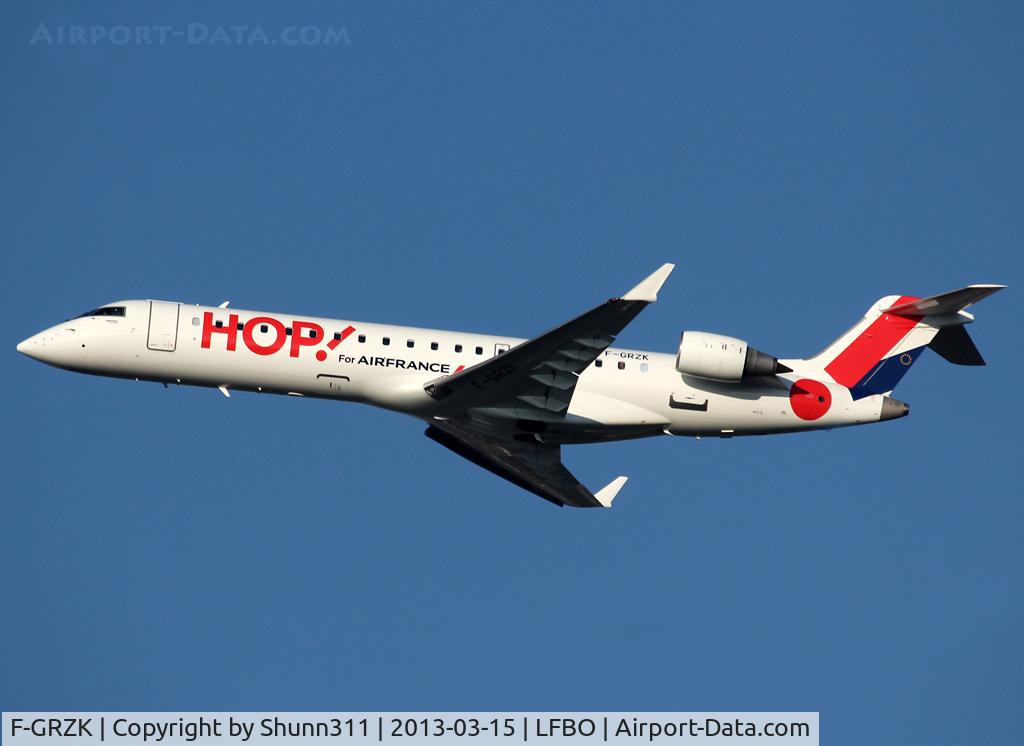 F-GRZK, 2005 Canadair CRJ-702 (CL-600-2C10) Regional Jet C/N 10198, Climbing after t/o rwy 32R in his new c/s