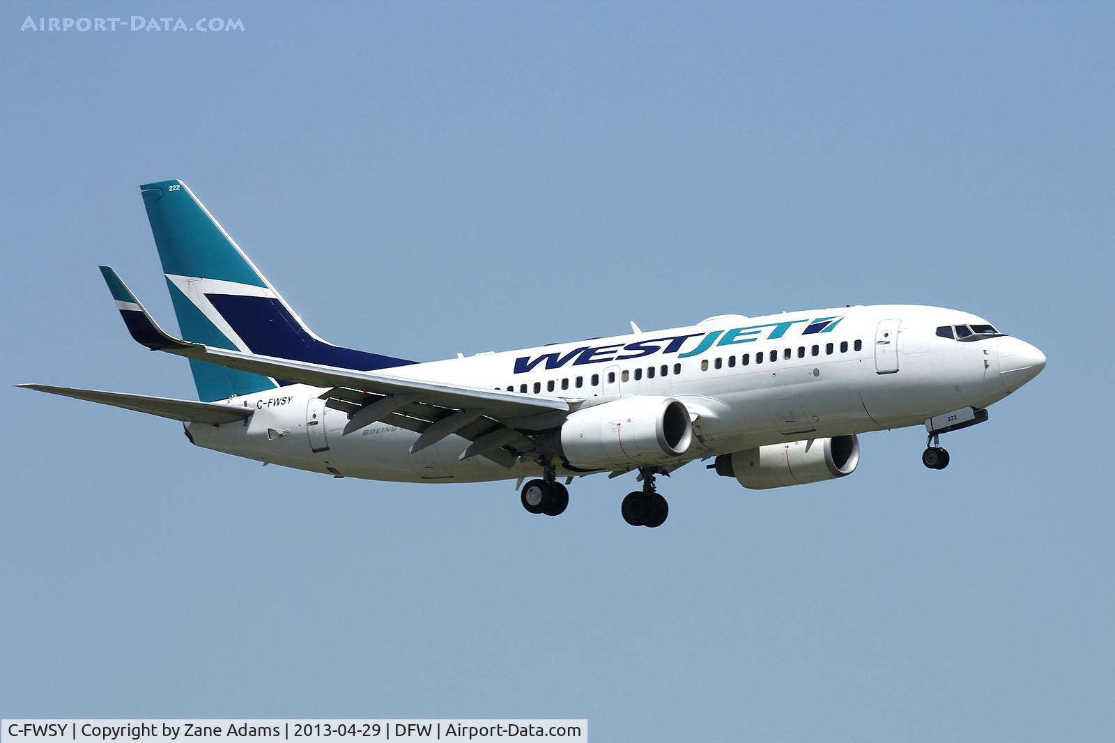 C-FWSY, 2004 Boeing 737-7CT C/N 32762, First WestJet flight landing at DFW Airport