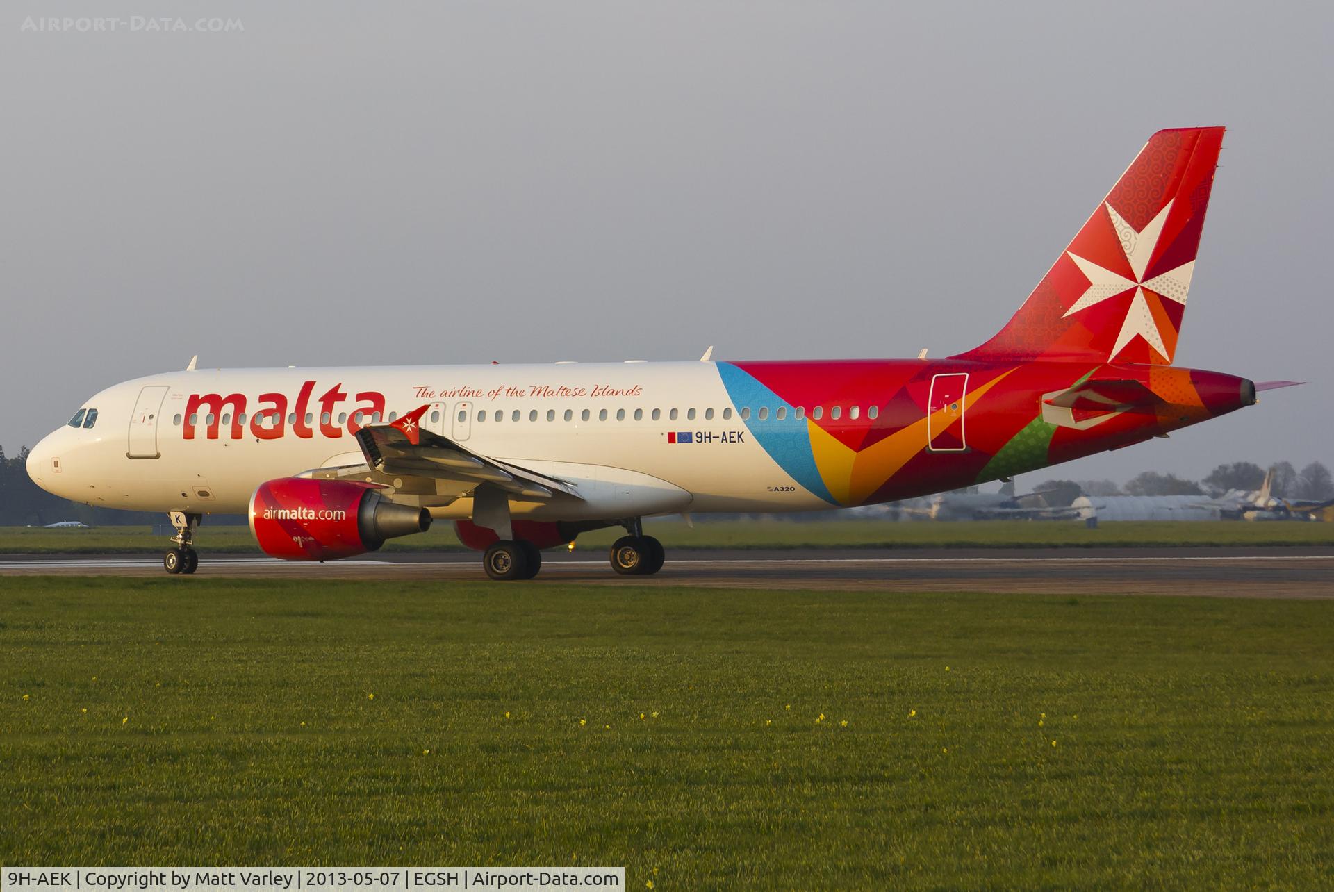 9H-AEK, 2004 Airbus A320-211 C/N 2291, Departing EGSH in the setting sun.