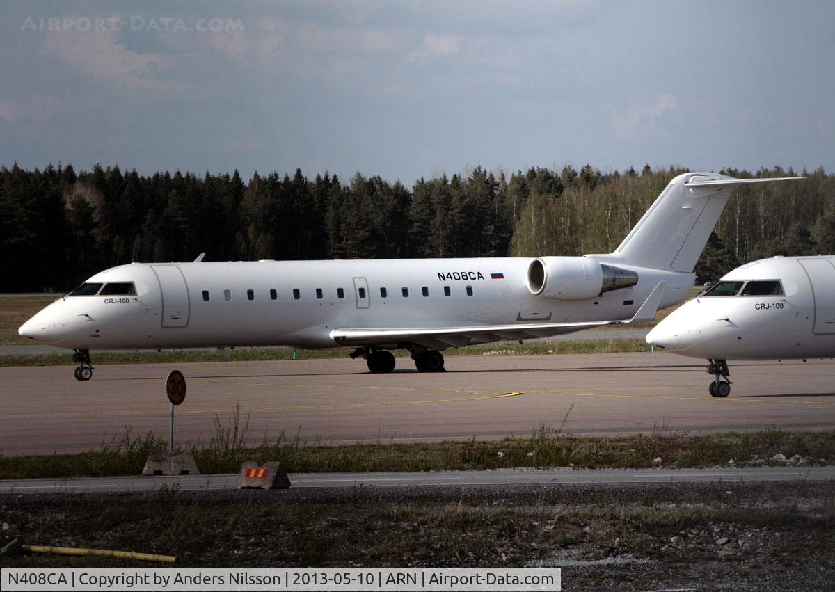 N408CA, 2000 Bombardier CRJ-100ER (CL-600-2B19) C/N 7440, Parked at ramp K together with N818CA.
