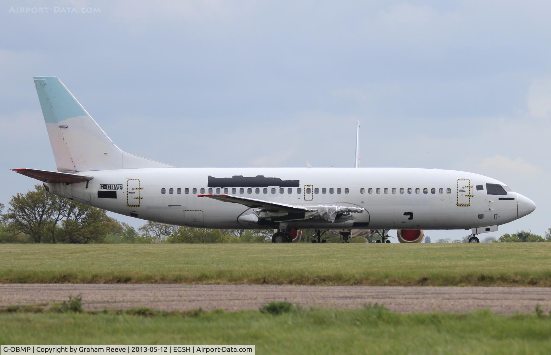 G-OBMP, 1992 Boeing 737-3Q8 C/N 24963, Parked with all the logo's removed.