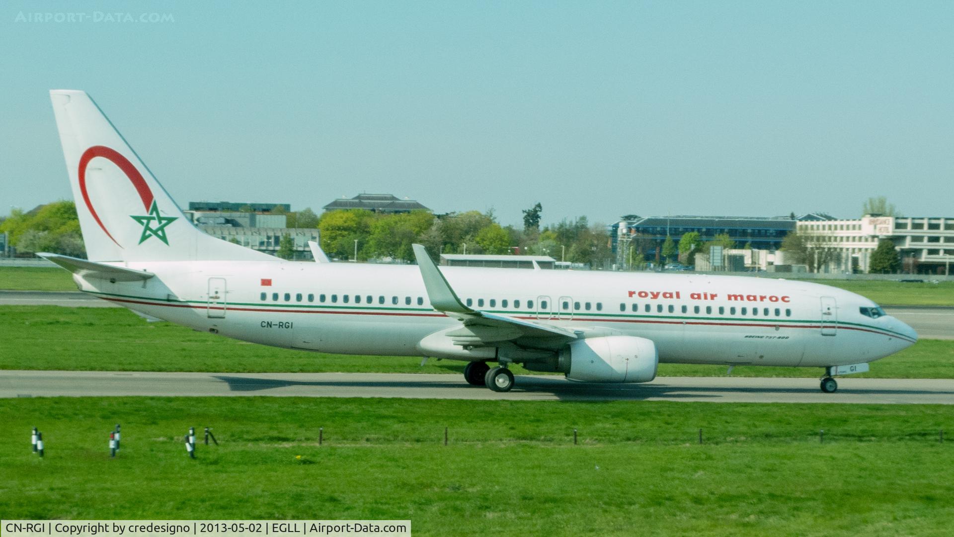 CN-RGI, 2011 Boeing 737-86N C/N 36831, Shot through the tinted windows of terminal 1 at Heathrow.