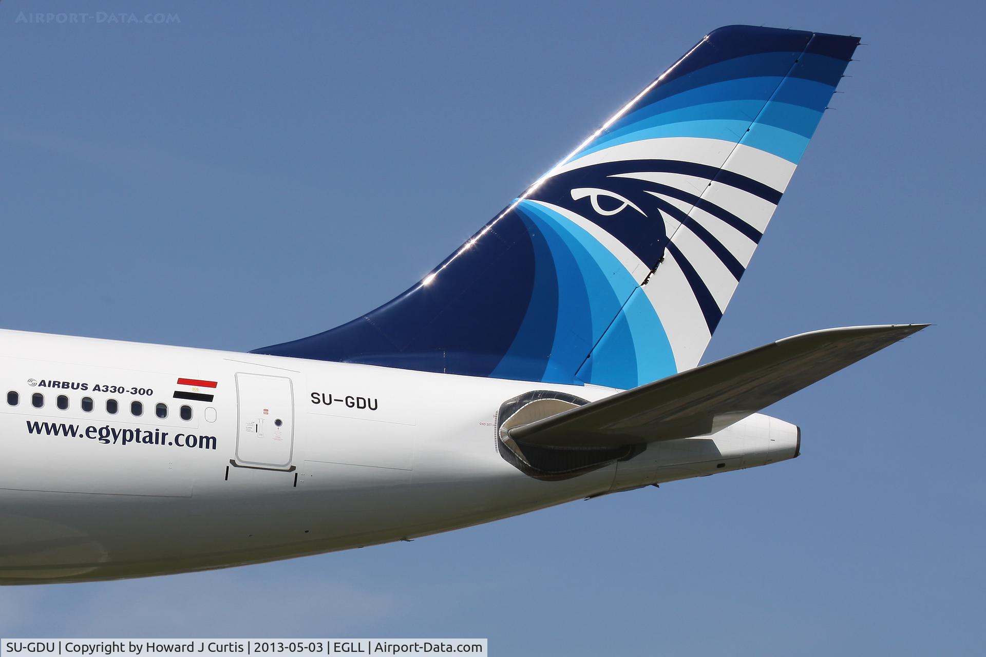 SU-GDU, 2011 Airbus A330-343X C/N 1238, Close up of the tail of this Egyptair machine on approach to runway 27L.