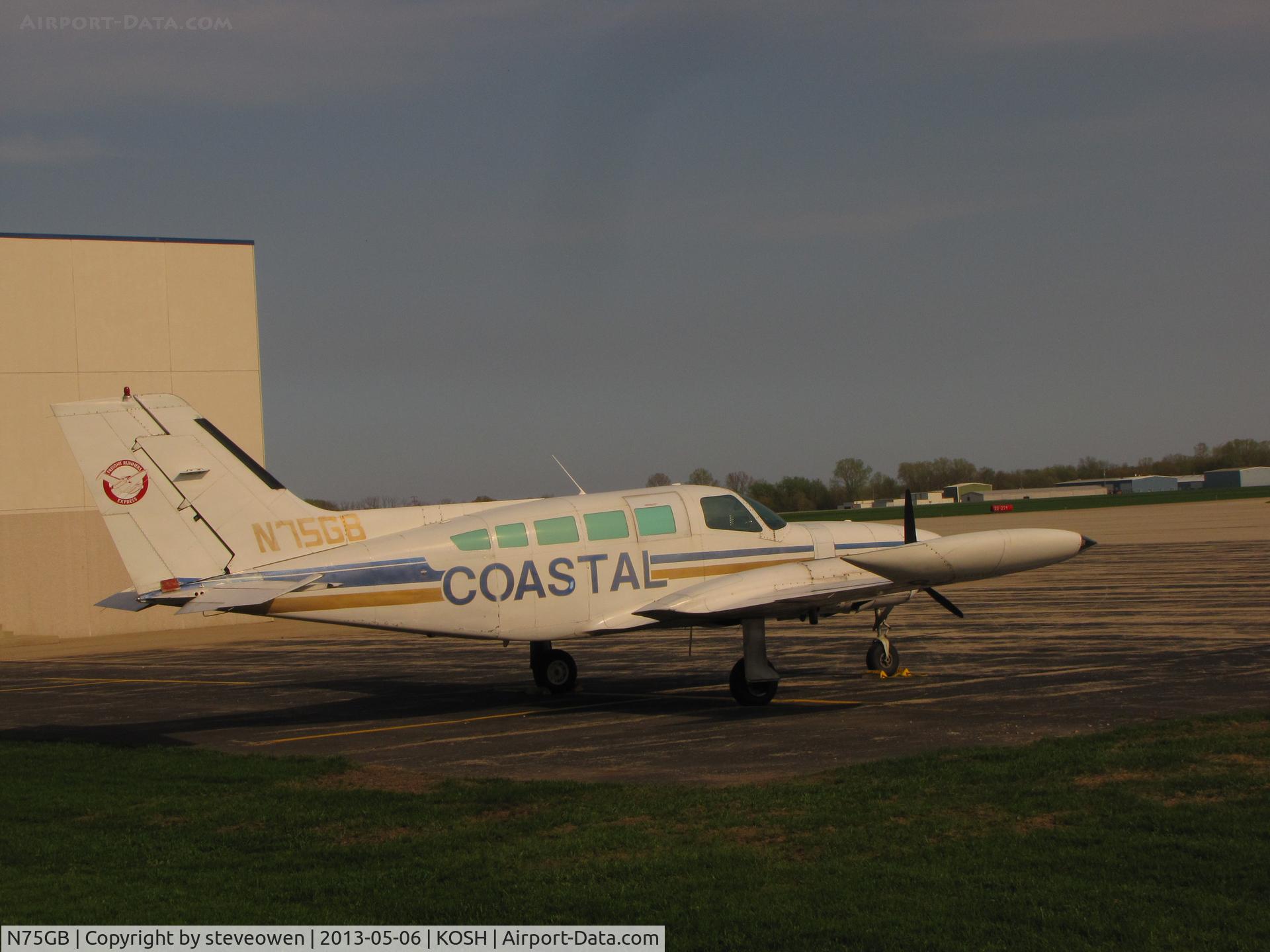 N75GB, 1975 Cessna 402B C/N 402B0912, Parked at Basler FBO ramp